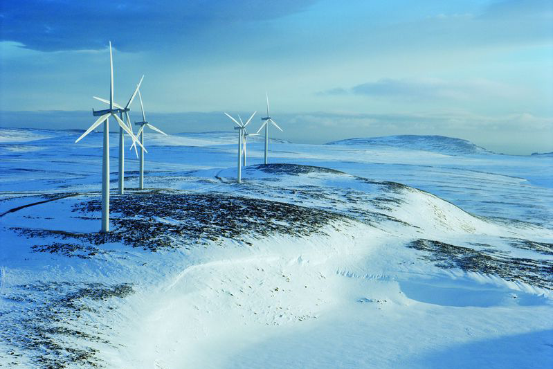Wind park on top of a snowy mountain